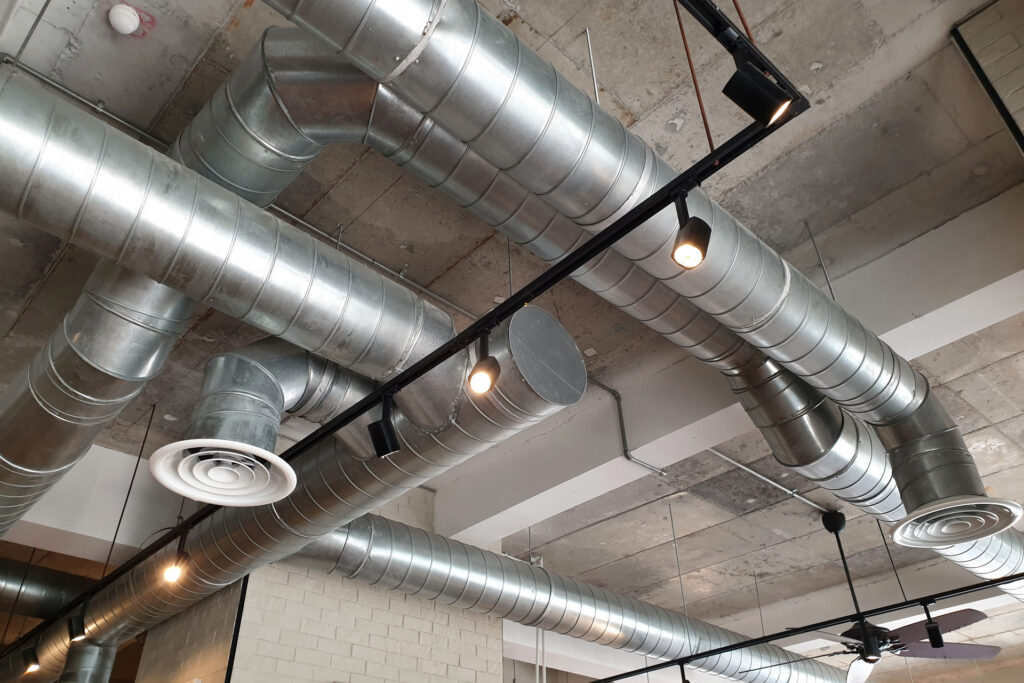 Ventilation,Pipes,In,Silver,Insulation,Material,Hanging,From,The,Ceiling